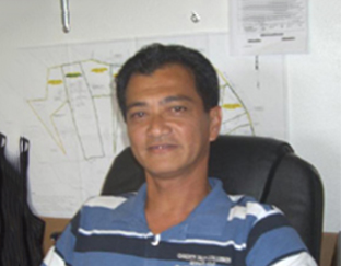 A man sitting in front of a map.